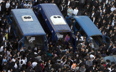 Mourners attend the funerals of Aryeh Kupinsky, Cary William Levine, and Avraham Goldberg, three of the five people killed in a synagogue in Jerusalem.