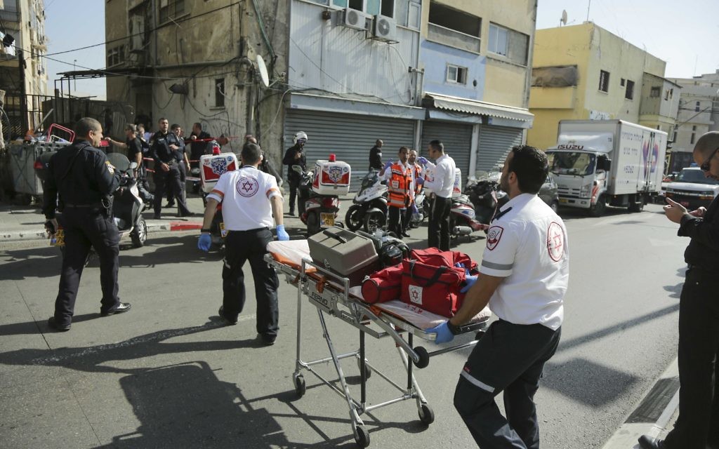 Medics attending to a stabbed soldier after a terror attack