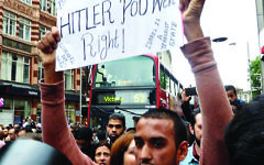 Hussain Yousef holding an anti-Semitic sign 'Hitler was right' in London, 2014 Hussain Yousef holding an anti-Semitic sign 'Hitler was right' in London, 2014