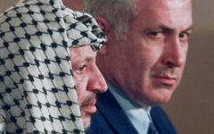 Israeli Prime Minister Benjamin Netanyahu, right, looks around PLO leader Yasser Arafat in 1996. Israeli Prime Minister Benjamin Netanyahu, right, looks around PLO leader Yasser Arafat in 1996.