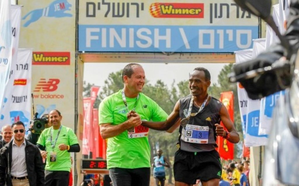 Mayor Nir Barkat with 2016 Jerusalem marathon winner Tadesa Dabi from Ethiopia