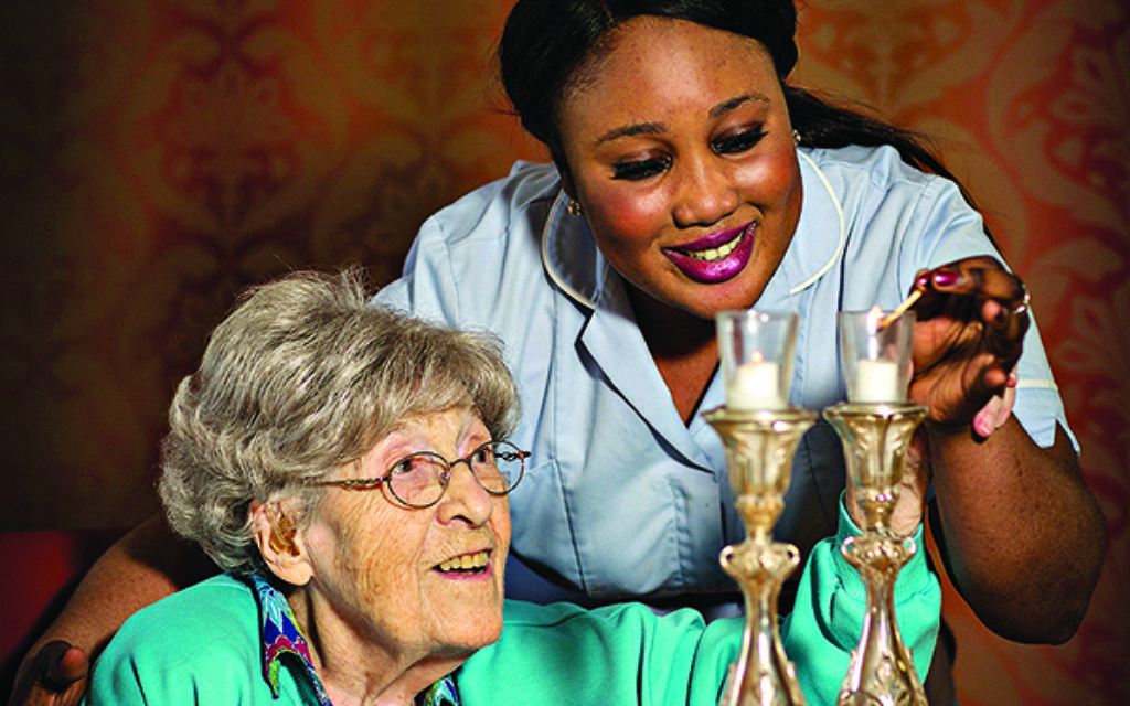 Carer Sandrine with care home resident Annie
