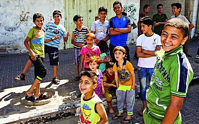 Children pictured on a street of Gaza City. Photo: Jens Buettner/dpa