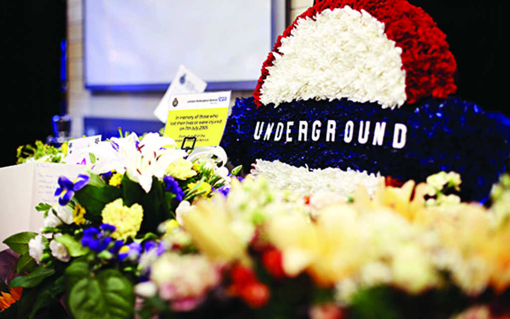 Flowers left at Russell Square tube station, London, as Britain remembers the July 7 attacks amid a welter of warnings about the enduring and changing threat from terrorism a decade on. Picture date: Tuesday July 7, 2015. See PA story MEMORIAL July7. Photo credit should read: Yui Mok/PA Wire