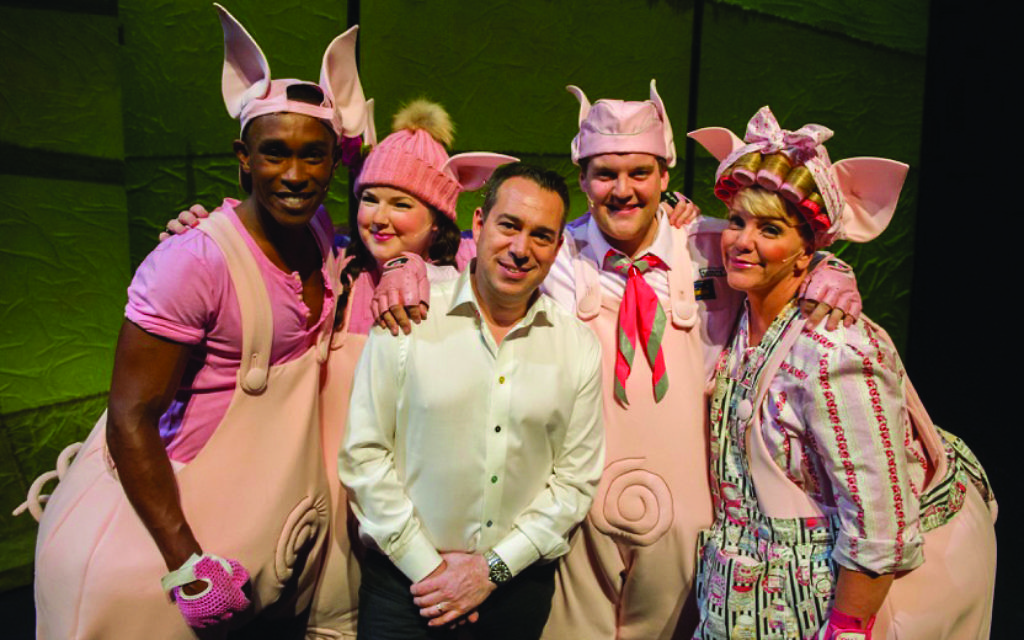 Kenny Wax on stage with cast members from his latest West End production, 3 Little Pigs