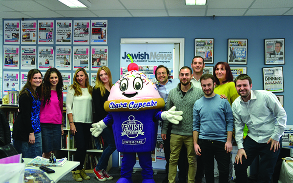 All smiles: the Jewish News team with Chava the Jewish Care cupcake.