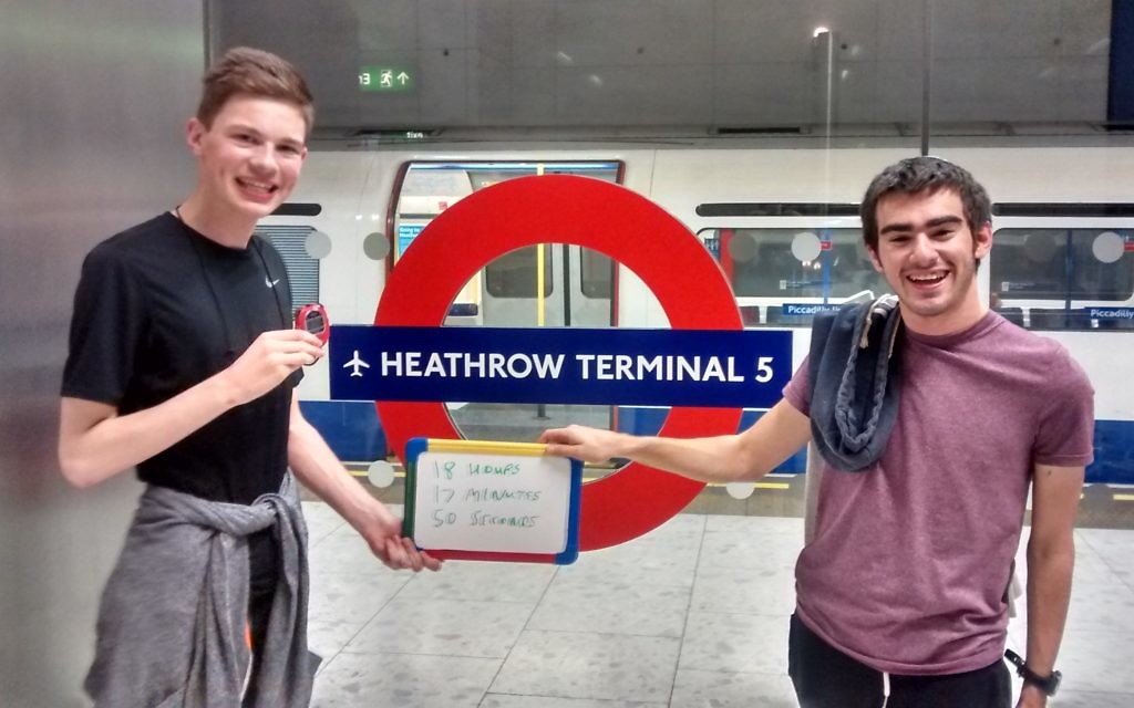 Daniel and Aaron celebrating the end of their day-long Tube journey