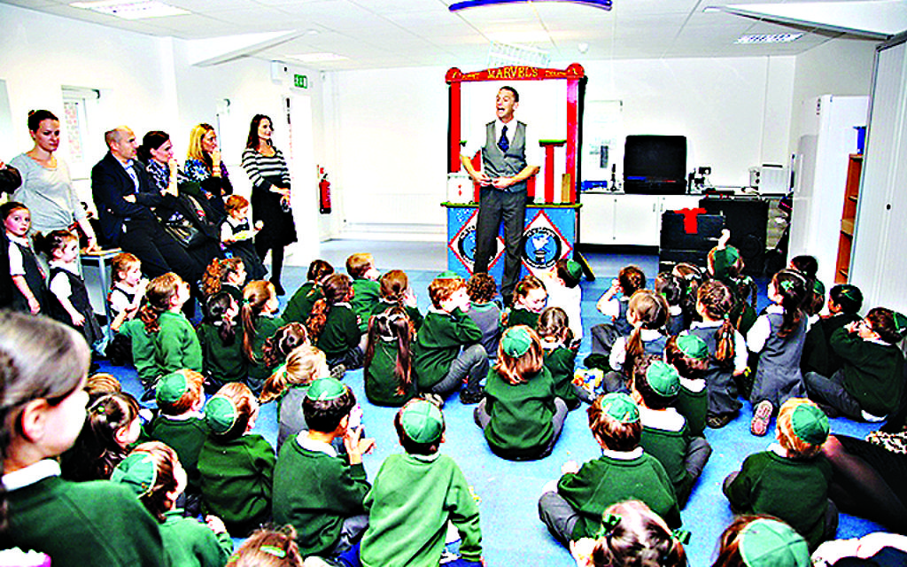 Etz Chaim pupils being entertained on the day the school officially opened in its new building