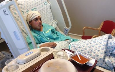 Ahmed Mansra in hospital, was accused of having stabbed and seriously wounded two Israelis.