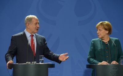 Israeli Prime Minister Benjamin Netanyahu with German chancellor Angela Merkel (Amos Ben Gershom/GPO/Israel Sun )