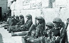 Israeli soldiers sit at the Western Wall, Judaism's holiest site, after capturing Jerusalem's Old City during the Six Day War, in June 1967. (AP Photo/Israeli Ministry of Defence,HO)