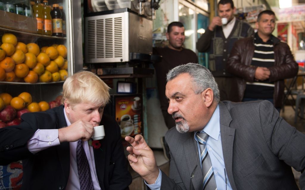 Mayor of London Boris Johnson has a coffee with adviser to the Palestinian president Ziad Al-Bandak in the Old City of Jerusalem during a tour of the historic town on the third day of his trade visit to Israel. PRESS ASSOCIATION Photo. Picture date: Tuesday November 10, 2015. See PA story POLITICS Johnson. Photo credit should read: Stefan Rousseau/PA Wire