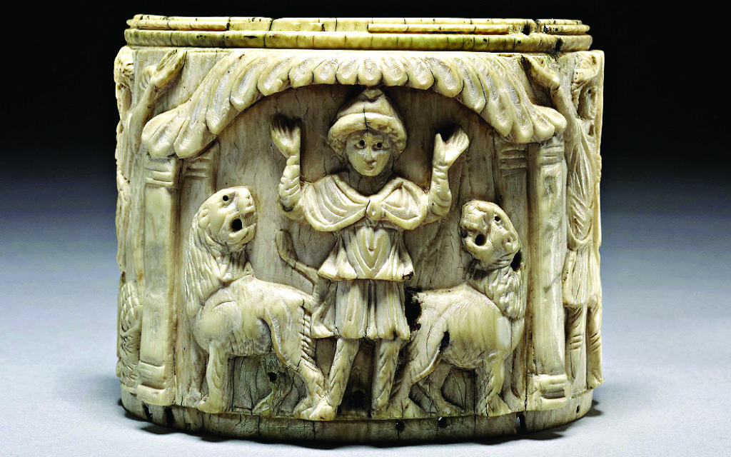 Ivory pyxis box depicting Daniel with arms raised in prayer flanked by two lions, Egypt 5th century. Picture credit: The Trustees of the British Museum