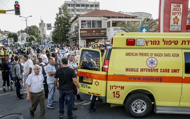 Scene after a terrorist attack in which three people were stabbed. The attack began on a bus and continued into the street in Rishon Lezion.
(Photo by Eliran Avital/MDA Spokesman/Israel Sun 2-11-15)