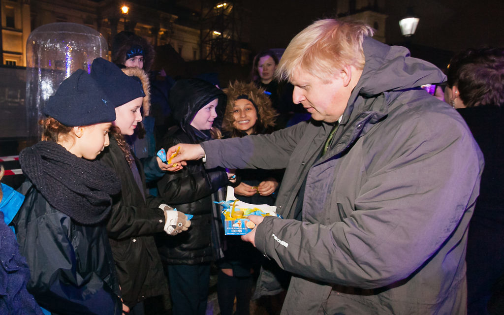 Boris Johnson hands out sweets to youngsters at Chanukah In The Square.