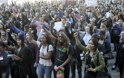 University California Los Angeles students stage a protest rally in a show of solidarity with protesters at the University of Missouri on Thursday, Nov. 12, 2015 in Los Angeles. Thousands of students across the U.S. took part in demonstrations at university campuses Thursday to show solidarity with protesters at the University of Missouri, and to shine a light on what they say are racial problems at their own schools. (AP Photo/Nick Ut)