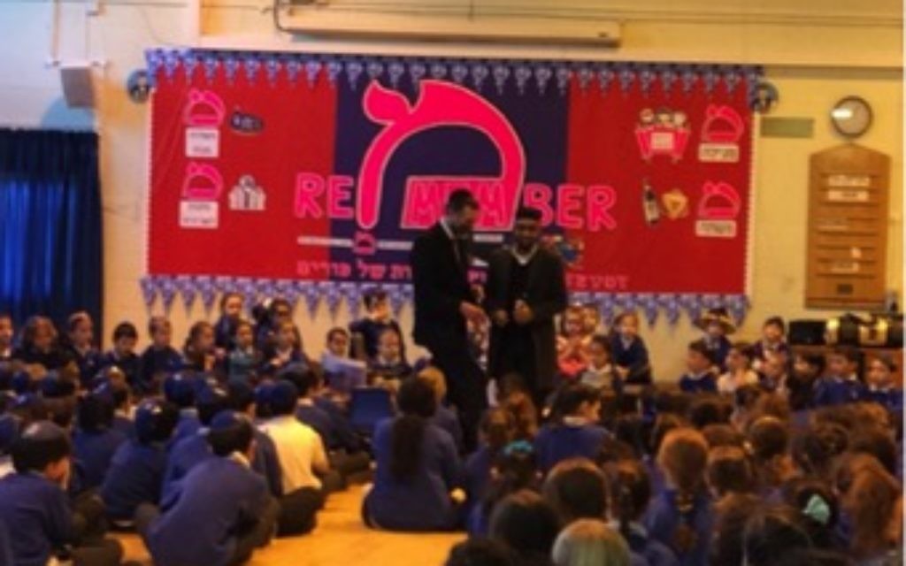 Imam Hasan and Rabbi Lister speaking together at an assembly