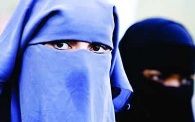 Muslim women wearing a full-face veil