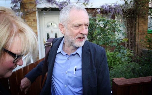 Jeremy Corbyn is greeted by the press on Friday morning after leaving his house.