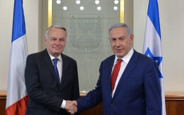 Benjamin Netanyahu shakes hands with Jean-Marc Ayrault, French Minister of Foreign Affairs and International Development as they meet in Jerusalem (Kobi Gideon/GPO/Israel )