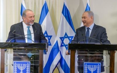 Lieberman and Netanyahu at a press conference after signing the coalition agreement (Photo credit: Amos Ben Gershom/GPO)
