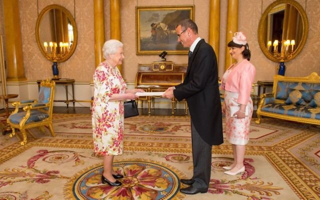 Ambassador of Israel Mark Regev and his wife Vered Regev meet Queen Elizabeth II during a private audience at Buckingham Palace (Photo credit: Dominic Lipinski/PA Wire)