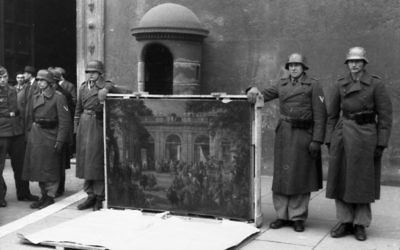 German soldiers of the Hermann Göring Division posing in front of Palazzo Venezia in Rome in 1944 , with looted art