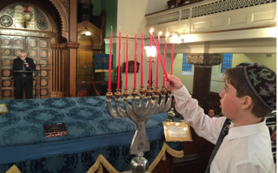Lighting candles to commemorate the Farhud at Lauderdale Road Synagogue