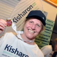 Kisharon chief executive  Dr Bev Jacobson with one of her three medals – she did the 10k, 5k and 1k races (photo: John Rifkin)