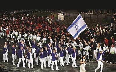 Israel's Shahar Zubari carries the flag during the team parade during the Olympic Games 2012 Opening Ceremony at the Olympic Stadium, London.