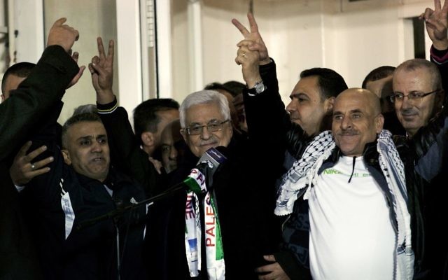 Palestinian President Mahmoud Abbas, receives a released prisoner during a welcome ceremony in the West Bank city of Ramallah (AP Photo/Nasser Nasser)