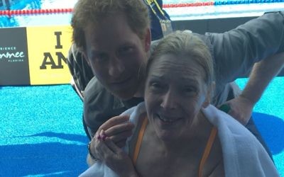 Sue with Prince Harry following her swim.