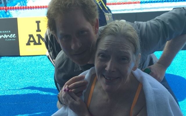 Sue with Prince Harry following her swim.