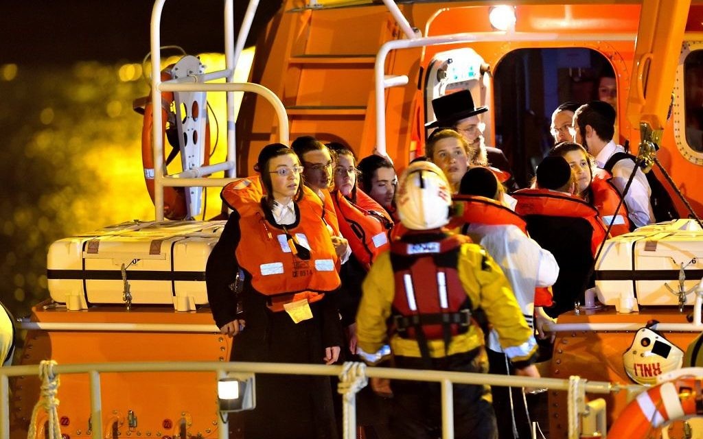 Orthodox Jewish kids with life jackets after being rescued (Credit: Stuart Brock Photography)