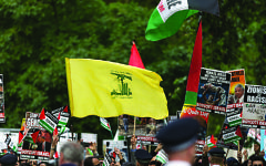 The striking Hezbollah flag during the Al-Quds rally in London, 2016 (Photo credit: Steve Winston)