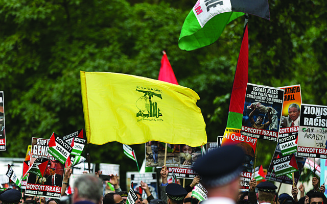 The striking Hezbollah flag during the Al-Quds rally in London, 2016 (Photo credit: Steve Winston)