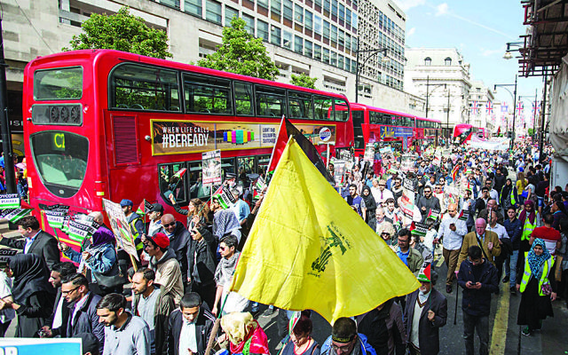 A Hezbollah flag at the Al-Quds Day parade in 2016  (Photo credit: Rick Findler/PA Wire)