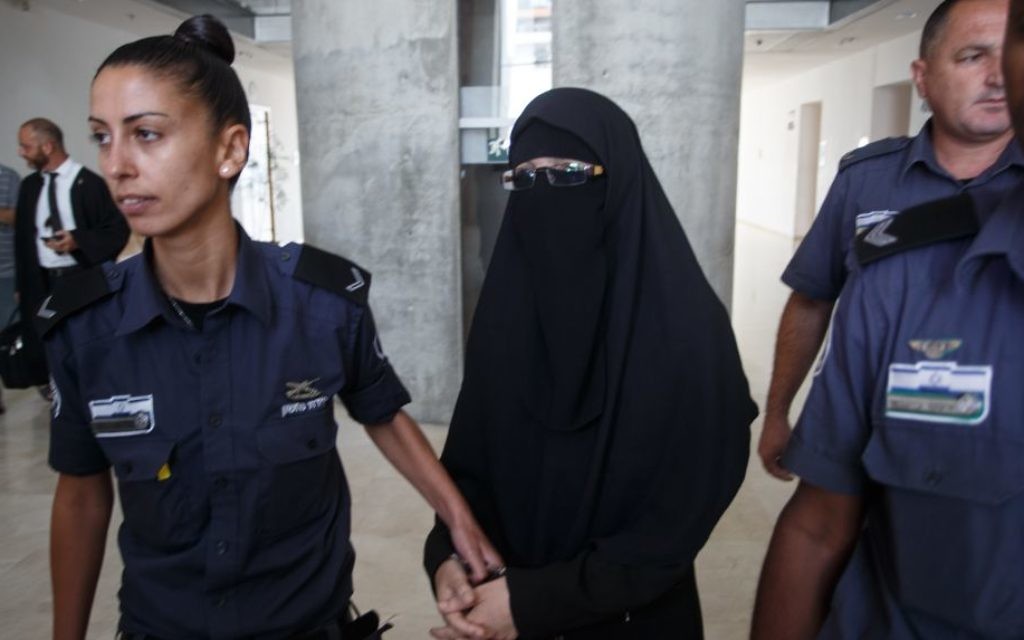 Iman Kanjo being led away in handcuffs in court (Photo by: JINIPIX)
