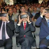 L-R: President Reuven Rivlin, Shimon Peres and Prime Minister Benjamin Netanyahu, view the centre through virtual goggles