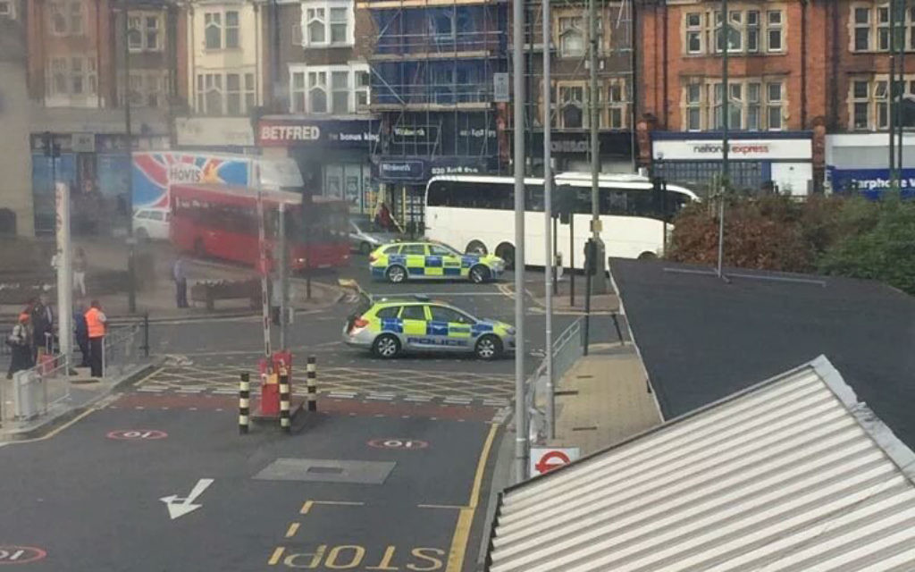 Police around the evacuated Golders Green station
