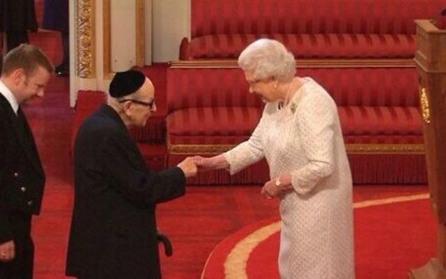 Reuben Turner receiving his MBE from the Queen