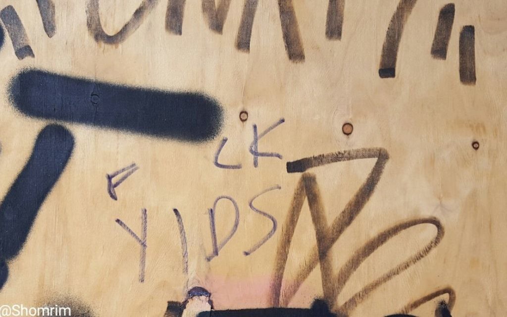 One of the abusive messages daubed on a poster in Stamford Hill