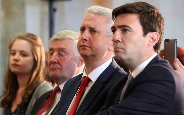(From second left) Interim mayor Tony Lloyd and Ivan Lewis sit next to Andy Burnham, before he was announced as the Labour candidate who will fight to become the mayor of Greater Manchester. (Photo credit: Peter Byrne/PA Wire)