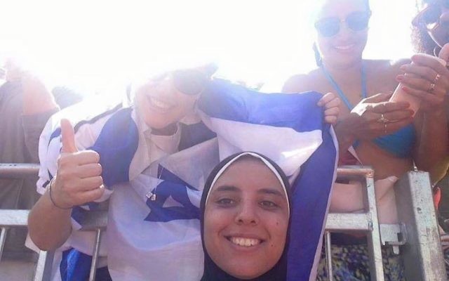 Egyptian volleyball player Doaa Elgabashy said she was unaware of the Israeli flag’s presence when this photo was taken. (StandWithUs Facebook page)