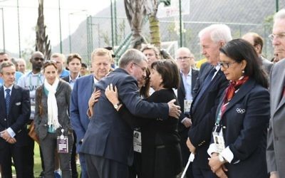 Ankie Spitzer embracing someone at the memorial to those who were murdered in 1972