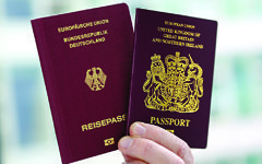 A British (R) and a German passport, in Berlin. (Photo: Britta Pedersen/dpa)