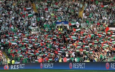 Celtic fans wave Palestinian flags