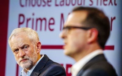 Jeremy Corbyn (left) looks on at his rival Owen Smith (right) during a leadership debate