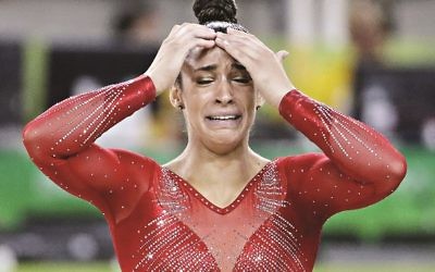 United States' Aly Raisman reacts to news of her silver medal for the artistic gymnastics women's individual all-around final at the 2016 Summer Olympics in Rio de Janeiro, Brazil, Thursday, Aug. 11, 2016. (AP Photo/David Goldman)