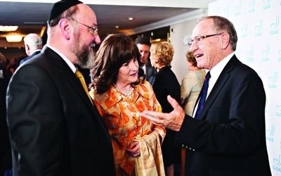 Professor Alan Dershowitz speaking with Chief Rabbi Ephraim Mirvis and his wife Valerie during the event with UJIA (Photo credit: Blake Ezra photography)